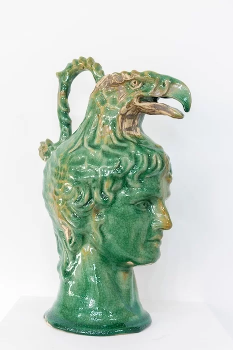 Mark Mann, Ganymede Vase - a hand-carved ceramic jug of a eagle's head on top of a human's head.