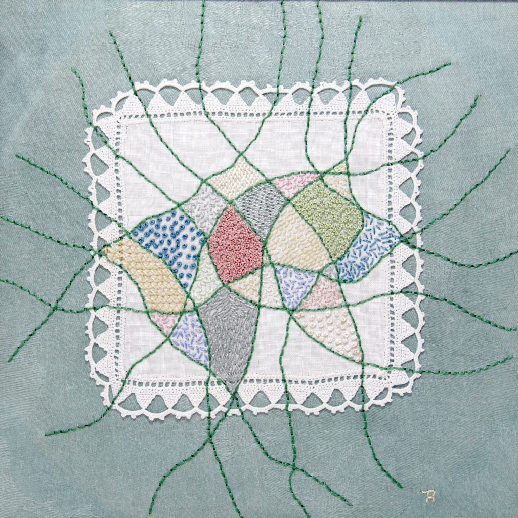 Hand stitching on vintage linen napkin 