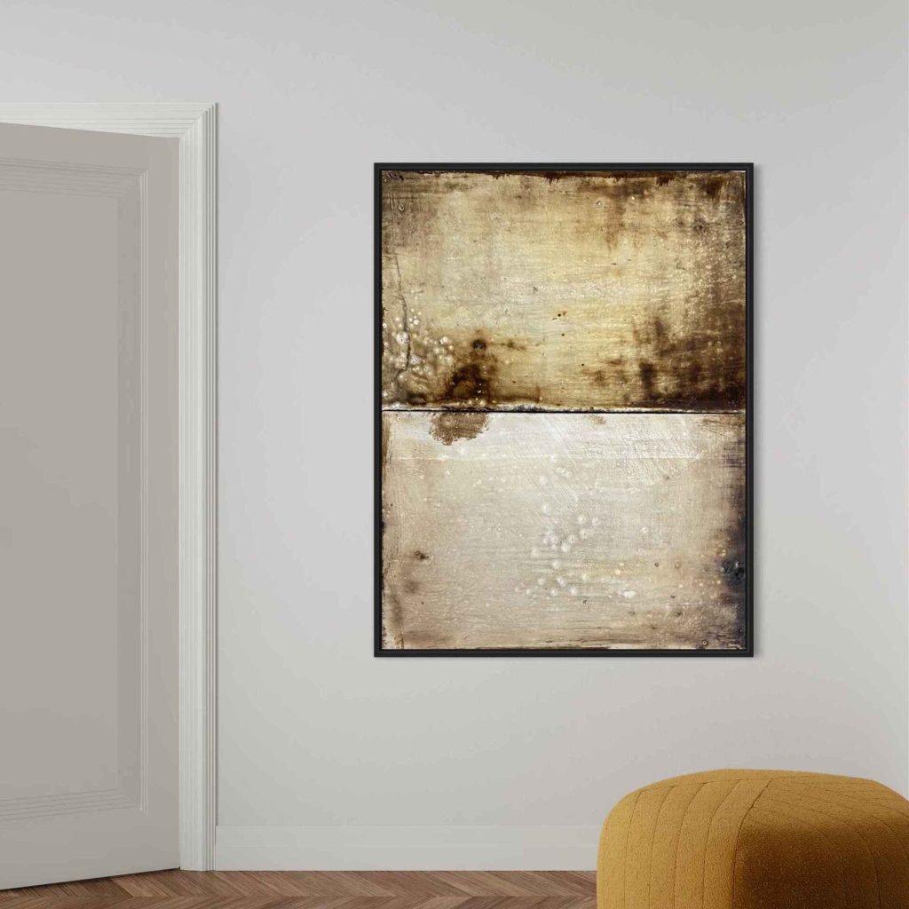 Artwork made out of beeswax and pigment, in earthy tones and rough splashes of darker and lighter brown